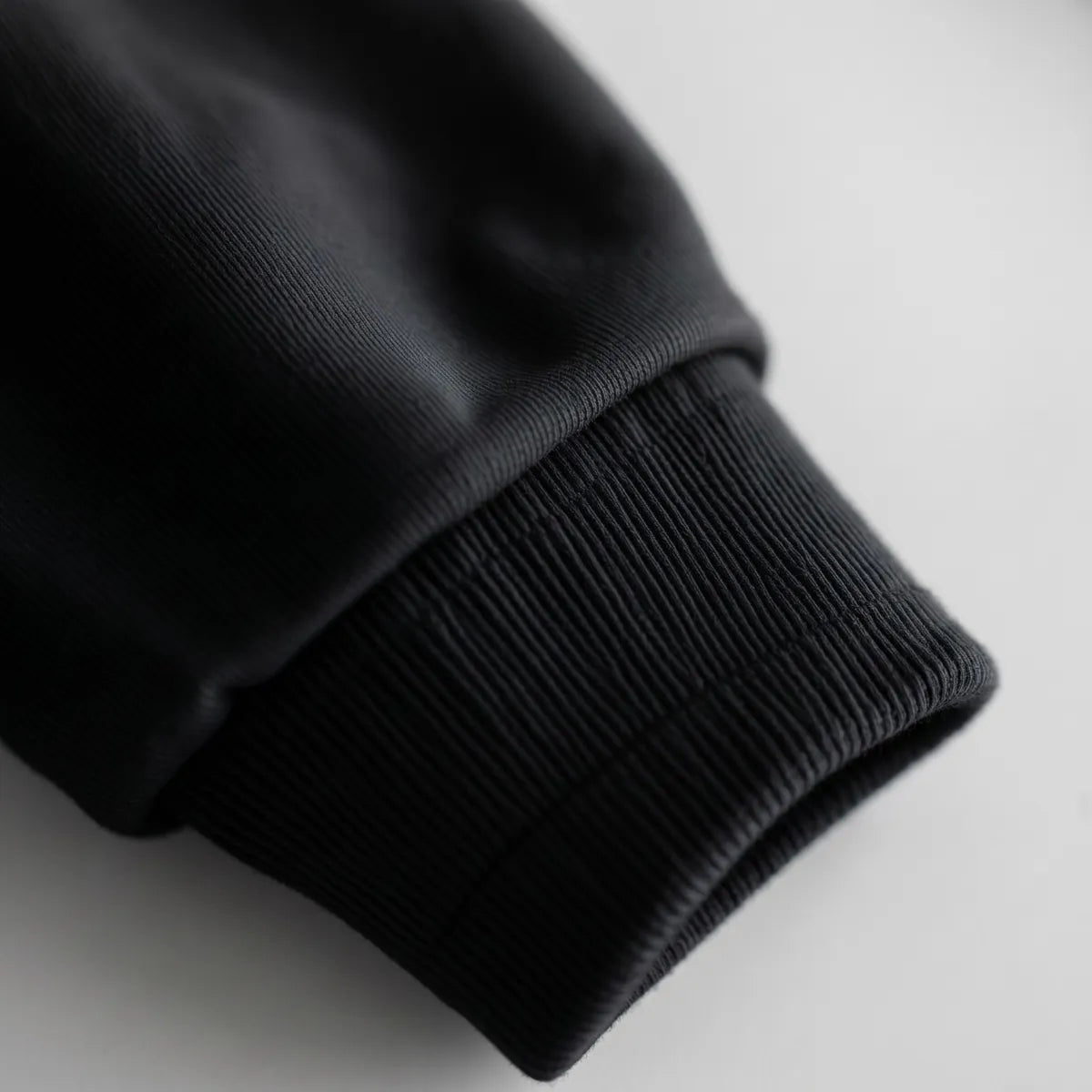 Hoodie in Black · ribbed cuff
