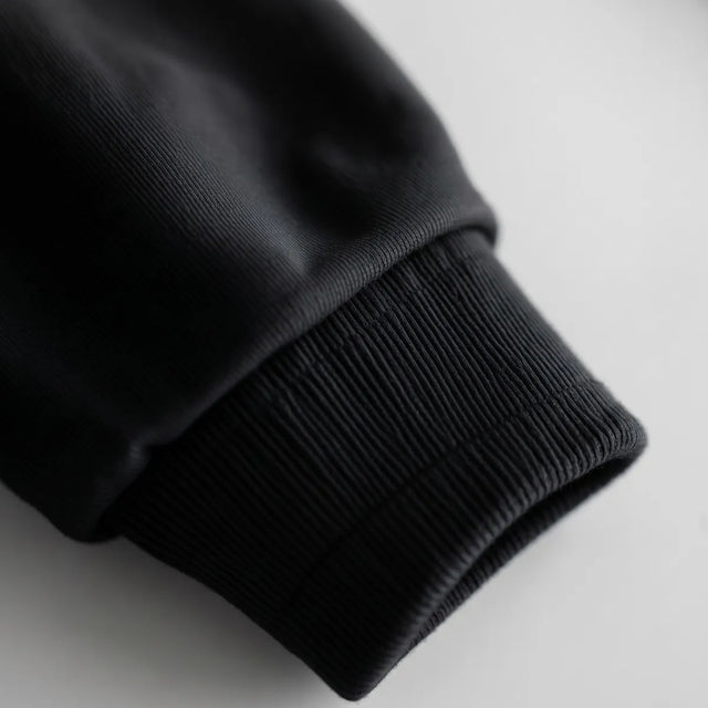 Hoodie in Black · ribbed cuff