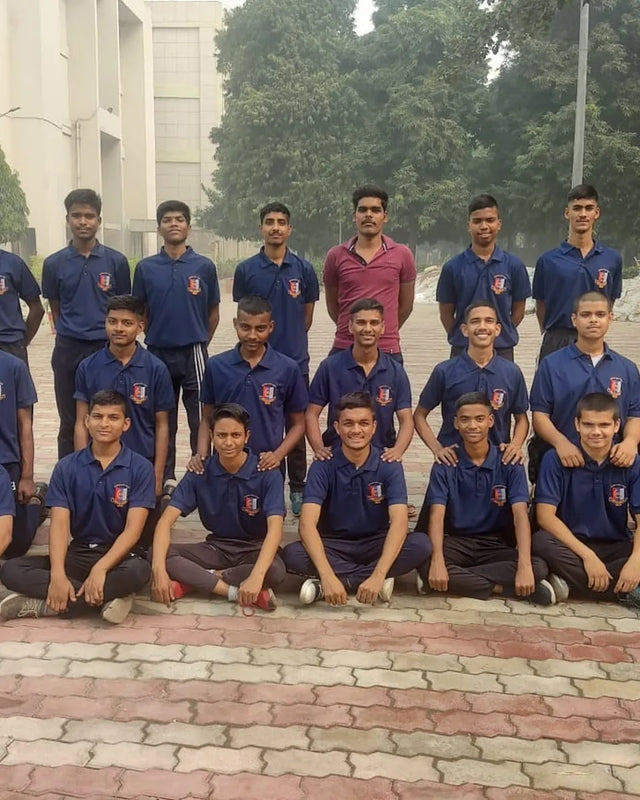 A team in navy polos with an embroidered chest logo